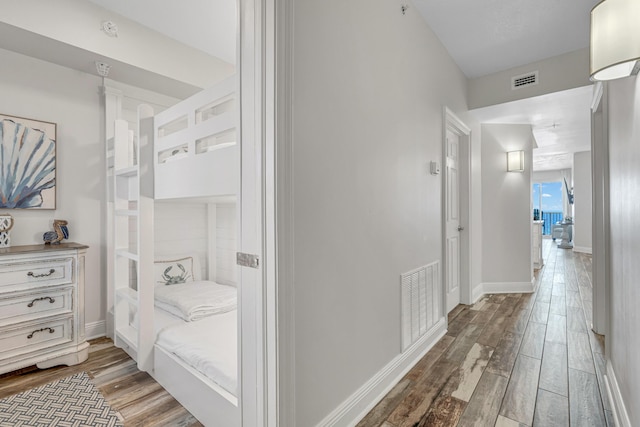 1111 Santa Rosa Blvd Unit 604, Fort Walton Beach, FL 32548 - corridor featuring baseboards, visible vents, and wood finished floors