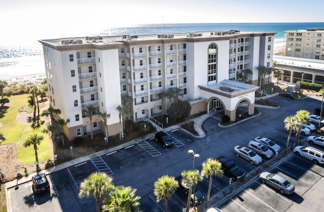 1111 Santa Rosa Blvd Unit 604, Fort Walton Beach, FL 32548 - view of building exterior featuring a water view and uncovered parking