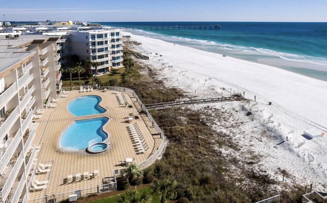 bird's eye view with a view of the beach and a water view