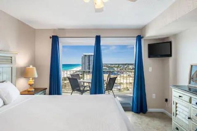 tiled bedroom with multiple windows, access to outside, and ceiling fan