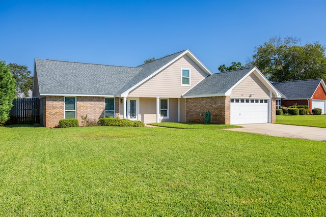 view of front of property featuring a garage and a front lawn