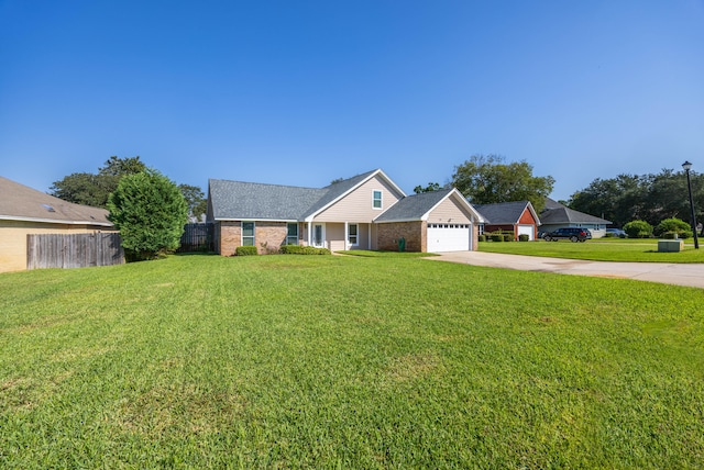 single story home featuring a front yard and a garage