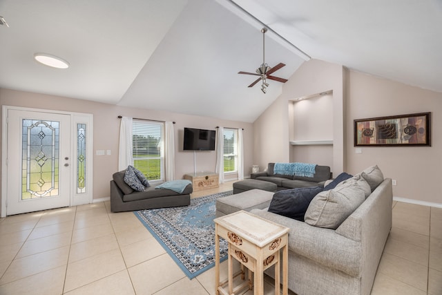 living room with ceiling fan, light tile patterned flooring, and vaulted ceiling with beams