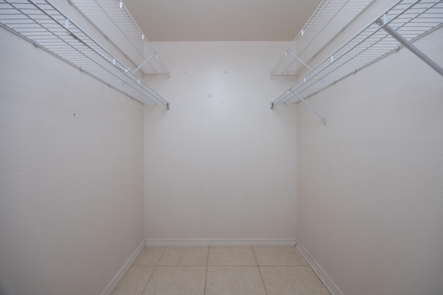 walk in closet featuring light tile patterned floors