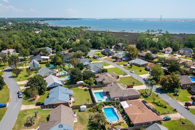 birds eye view of property with a water view