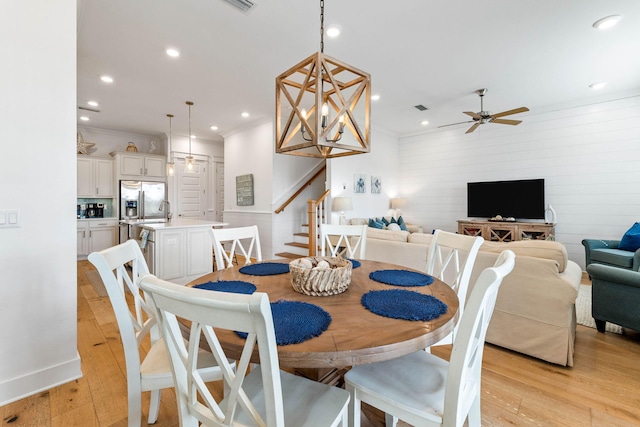 dining space featuring light hardwood / wood-style flooring and ceiling fan