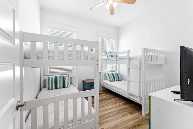 bedroom featuring ceiling fan and hardwood / wood-style flooring