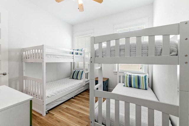 bedroom with ceiling fan and hardwood / wood-style floors