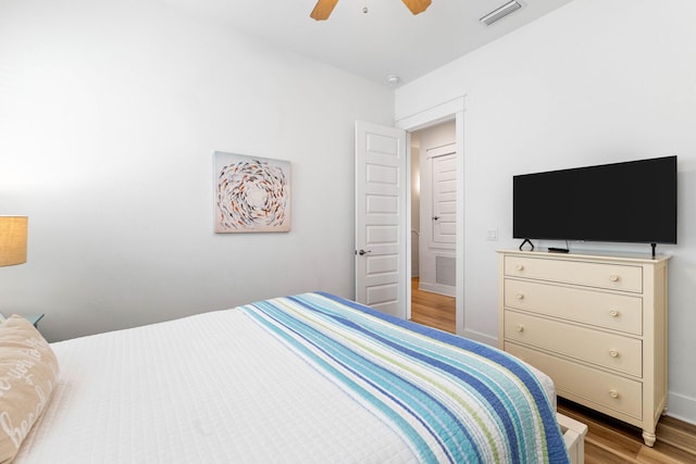 bedroom featuring light hardwood / wood-style flooring and ceiling fan