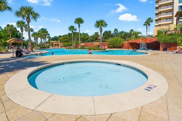 view of swimming pool with a patio and a gazebo