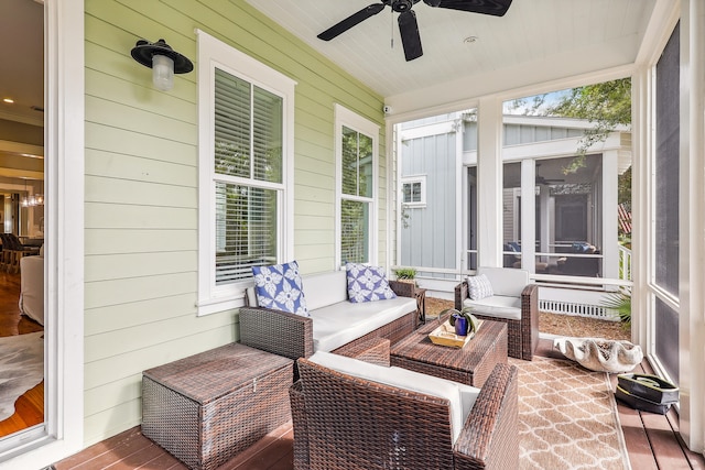 sunroom / solarium with wooden ceiling and ceiling fan