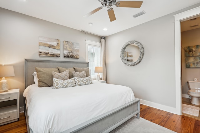 bedroom with wood-type flooring, ceiling fan, and ensuite bathroom