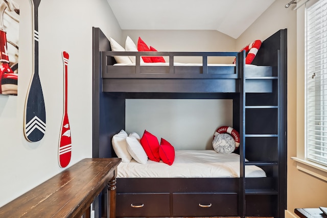 bedroom featuring vaulted ceiling