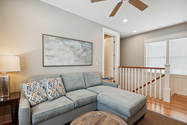 living room with ceiling fan and wood-type flooring