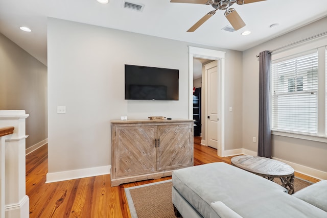 bedroom with light hardwood / wood-style flooring and ceiling fan