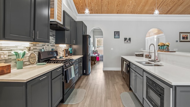 kitchen featuring ornamental molding, appliances with stainless steel finishes, wooden ceiling, and sink