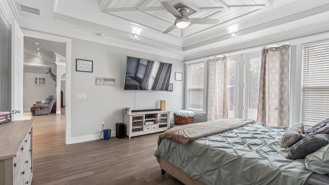 bedroom featuring ceiling fan, crown molding, and dark hardwood / wood-style floors