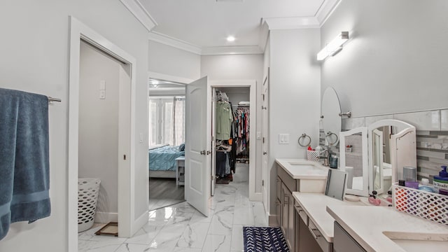 bathroom featuring ceiling fan, vanity, and crown molding