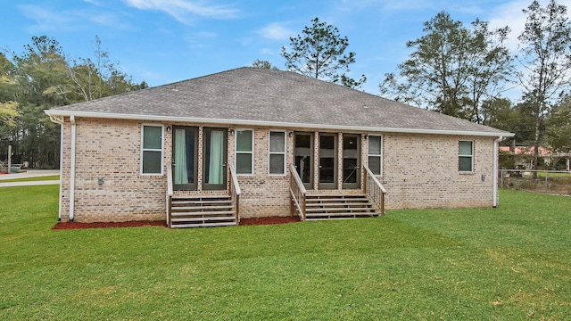 back of house featuring a yard