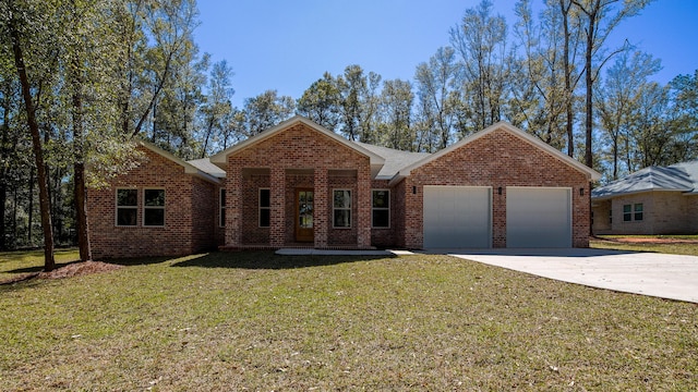 single story home featuring a garage, driveway, brick siding, and a front yard