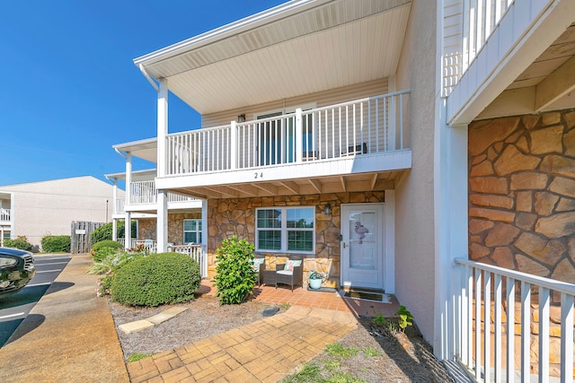 property entrance with a balcony