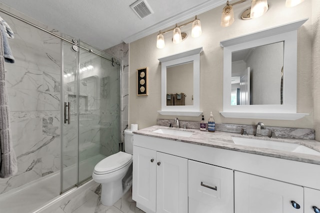 bathroom featuring ornamental molding, vanity, toilet, and an enclosed shower