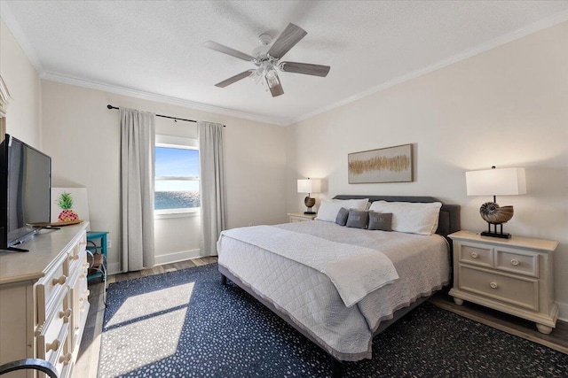 bedroom featuring ceiling fan, dark hardwood / wood-style flooring, ornamental molding, and a textured ceiling