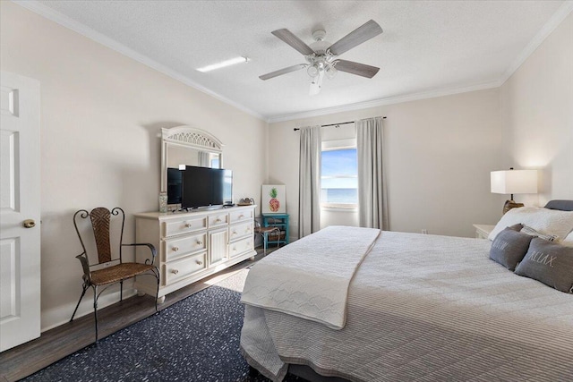 bedroom featuring wood-type flooring, a textured ceiling, ceiling fan, and ornamental molding