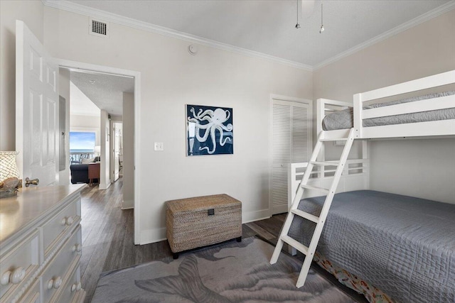 bedroom featuring dark hardwood / wood-style flooring and ornamental molding