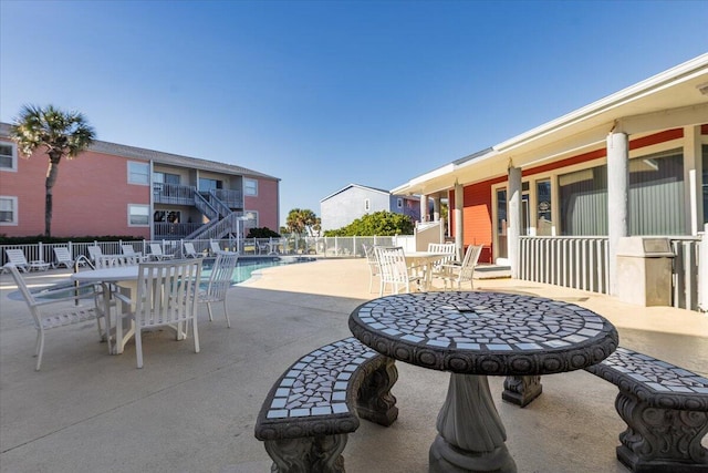 view of patio / terrace featuring a community pool