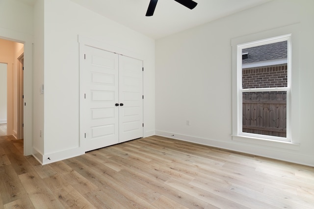 unfurnished bedroom with a closet, ceiling fan, and light hardwood / wood-style floors