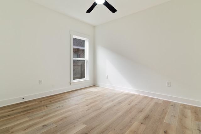 empty room featuring ceiling fan and light wood-type flooring