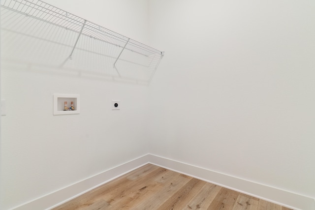 laundry area featuring hardwood / wood-style floors, hookup for a washing machine, and hookup for an electric dryer