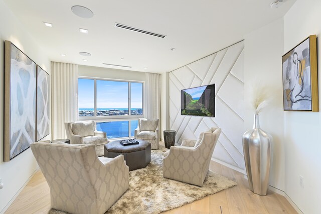 living room with light hardwood / wood-style flooring