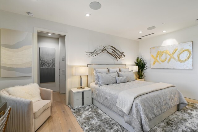 bedroom featuring light hardwood / wood-style floors