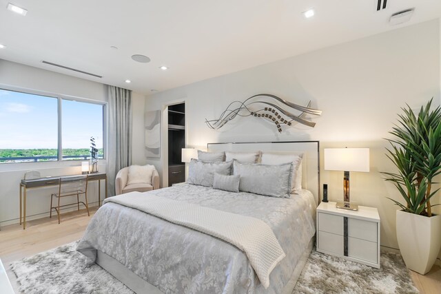 bedroom with light hardwood / wood-style flooring