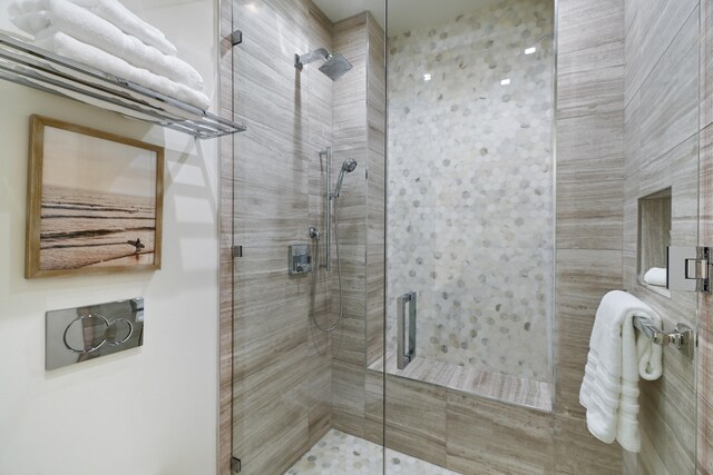 bathroom with a shower with shower door