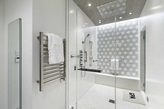 bathroom featuring walk in shower and radiator heating unit