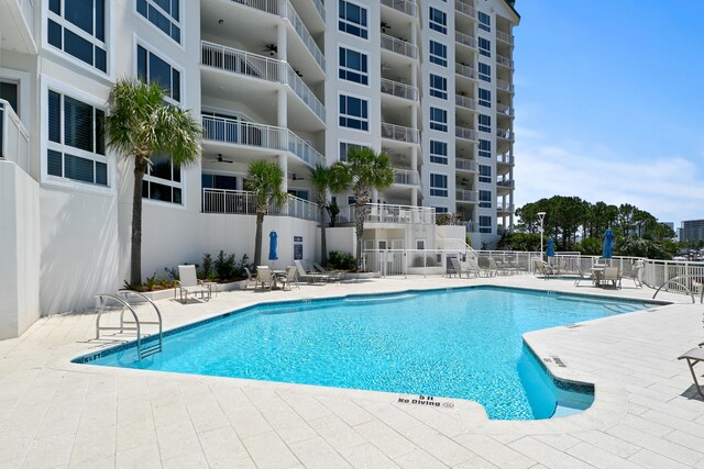 view of swimming pool with a patio area