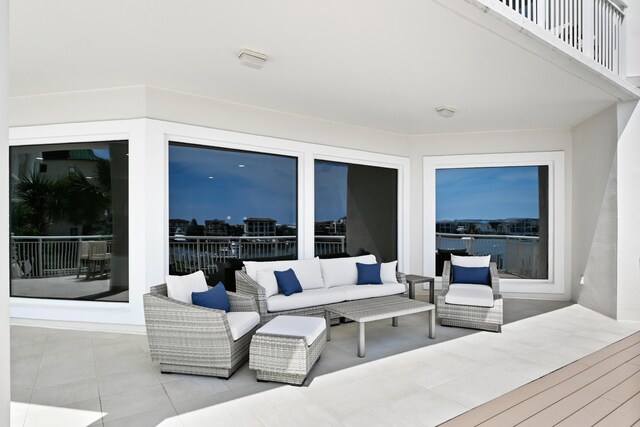 view of patio with a balcony and an outdoor living space