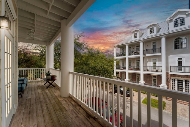 view of balcony at dusk