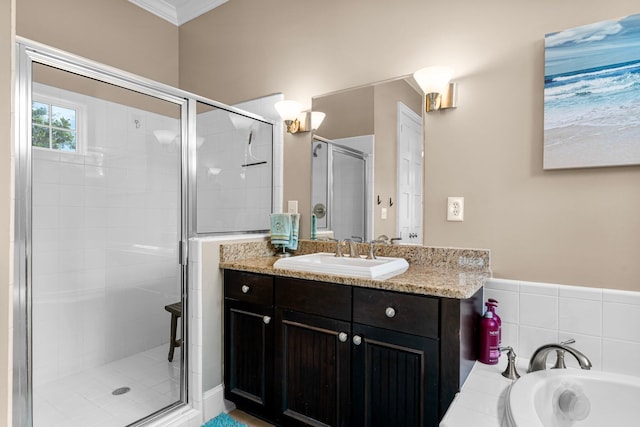 bathroom with independent shower and bath, vanity, and ornamental molding