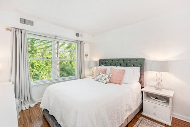 bedroom featuring dark hardwood / wood-style flooring