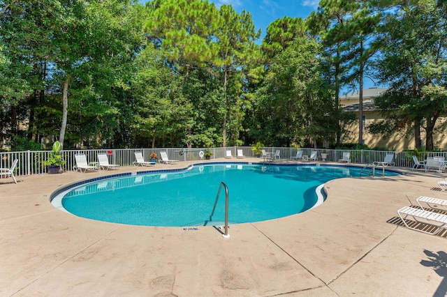 view of swimming pool with a patio