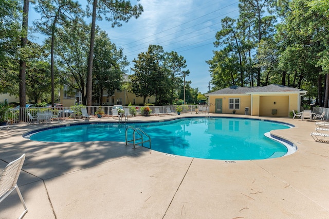 view of swimming pool with a patio