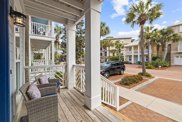 wooden terrace featuring covered porch