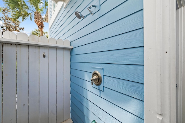 exterior details with wood walls and a skylight