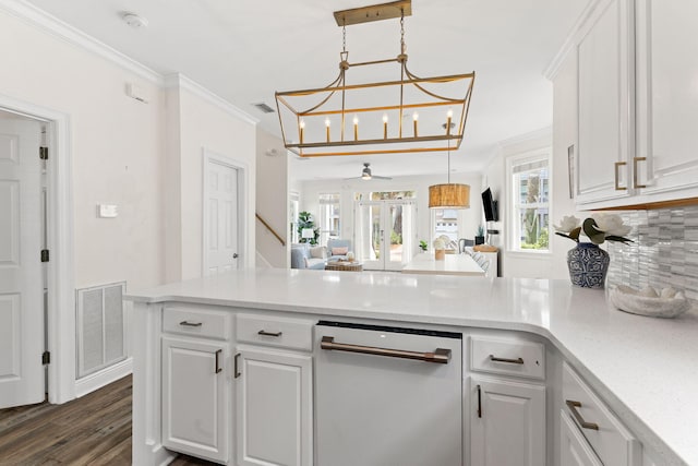 kitchen with ceiling fan with notable chandelier, dark hardwood / wood-style floors, ornamental molding, and white cabinetry