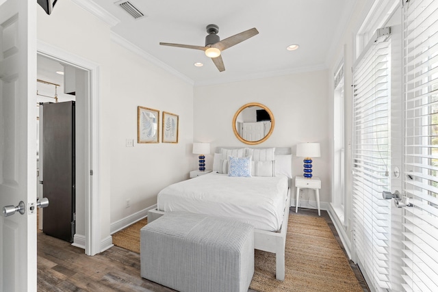 bedroom with ceiling fan, dark hardwood / wood-style floors, and crown molding