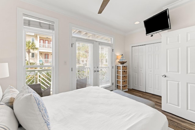 bedroom featuring dark wood-type flooring, access to exterior, a closet, crown molding, and ceiling fan